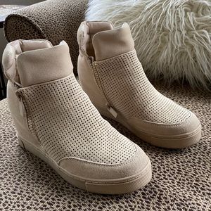 Wedge sneaker with zip closure. Almost like new!  Size 9.5